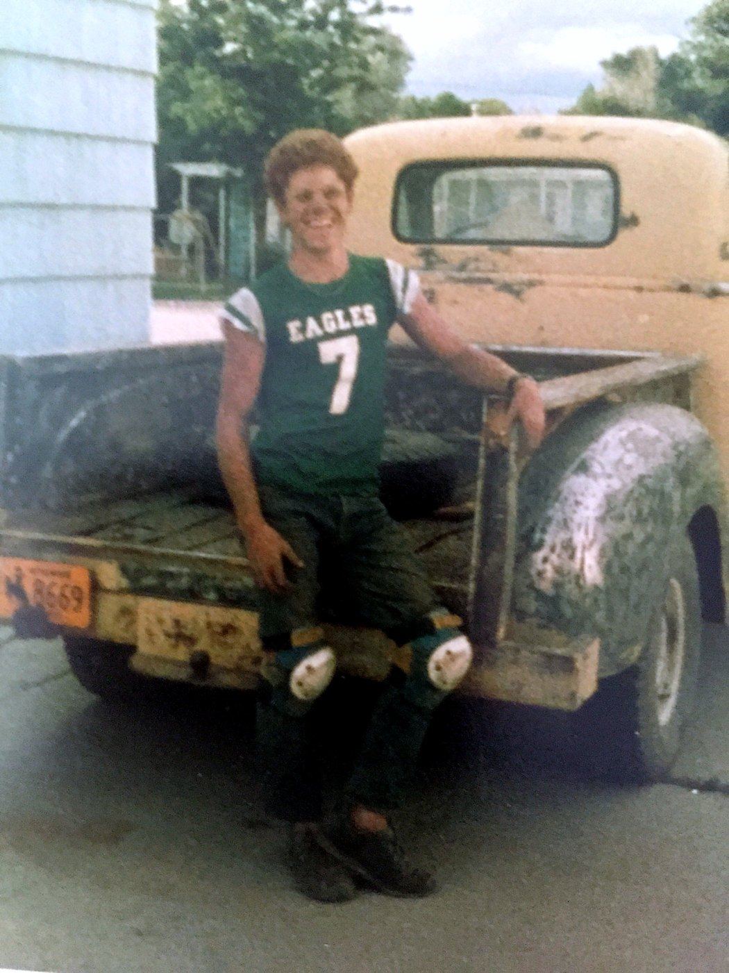 Rich Ashburn at 14, sitting on the tailgate of the 1954 Chevy truck he restored with his grandfather